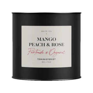 Czarna puszka herbaty Teministeriet Fairtrade Collection Mango Peach & Rose, organiczna biała herbata o smaku mango, brzoskwini i róży, 50g.