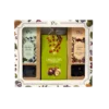 Wielkanocny zestaw prezentowy dostępny w sklepie z kawą, zawierający dwie herbaty liściaste Tea Selection – Chabrowy Poranek i Cytrusowy Dotyk, kulki z orzechów laskowych w czekoladzie oraz zaparzacz do herbaty, zamknięty w ozdobnym opakowaniu z motywami roślinnymi.