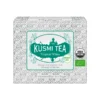 Kartonowe opakowanie herbaty Kusmi Tea Tropical White zawierające 20 saszetek, z ozdobną białą grafiką kwiatową i zielonym logo, oferujące organiczną białą herbatę o smaku mango i marakui.