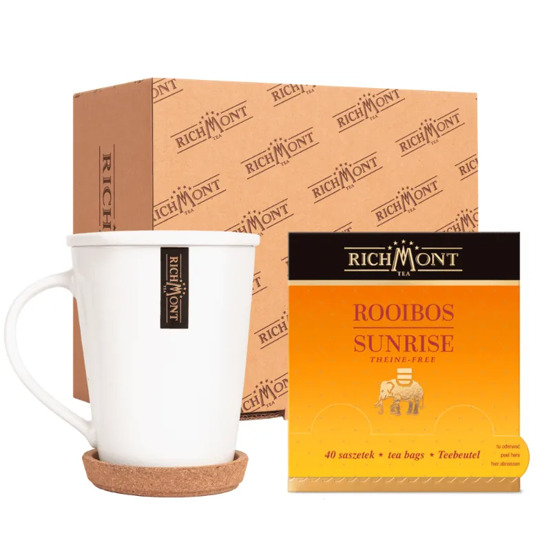 Elegancki zestaw zawierający herbata Rooibos Sunrise w saszetkach oraz stylowy kubek Richmont z korkowym podstawką. Idealny do delektowania się aromatycznym naparem, ten zestaw doskonale sprawdzi się w każdej kuchni oraz jako wyjątkowy prezent dla miłośników herbaty.